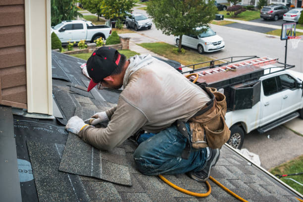 Professional Roofing technician working in Runnells, IA